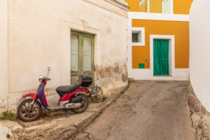 Sicily - Sunny impressions of the Aeolian Islands, also known as Aeolian Islands or Isole Eolie: Lipari, Stromboli, Salina, Vulcano, Panarea, Filicudi and Alicudi. Colorful houses and scooters on Panarea. Sicily - Sunny impressions of the Aeolian Islands, also known as Aeolian Islands or Isole Eolie: Lipari, Stromboli, Salina, Vulcano, Panarea, Filicudi and Alicudi. Colorful houses and scooters on Panarea.